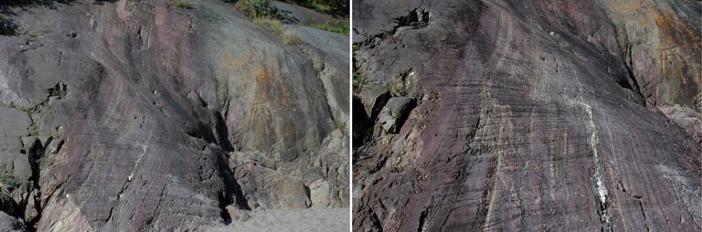 Double colour image of smooth green and purple rocks with scratch marks